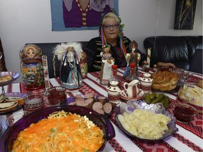 Barb Dedi, wearing traditional Ukrainian garb, prepares a number of Ukrainian dishes for Thanksgiving.