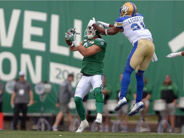 Rob Bagg #6 of the Saskatchewan Roughriders completes while Maurice Leggett #31 of the Winnipeg Blue Bombers covers during the Labour Day Classic held at Mosaic Stadium in Regina, Sask. on Sunday Sept. 4, 2016.