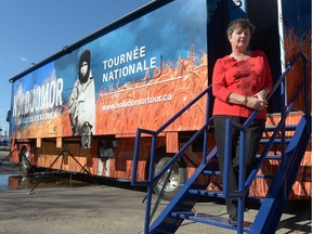 Roma Dzerowicz stands on the steps of an Holodomor educational bus near St. Basil's Ukrainian Catholic Church in Regina, Sask. on Sunday Sept. 25, 2016.