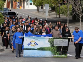 People were walking down 19th Street West to take part in the annual  FASD community walk put on by the Metis Addictions Council of Saskatchewan on  Friday.