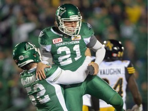 The Saskatchewan Roughriders' Tyler Crapigna, 21, celebrates a last-play field goal that gave his team a 20-18 victory over the visiting Hamilton Tiger-Cats on Sept. 24.