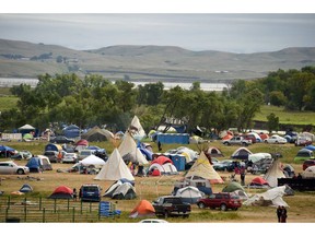 The Missouri River is seen beyond an encampment September 4, 2016 near Cannon Ball, North Dakota where hundreds of people have gathered to join the Standing Rock Sioux Tribe's protest of the Dakota Access Pipeline (DAPL) that is slated to transport approximately 470,000 barrels of oil per day from the Bakken Oil Field in North Dakota to refineries in Illinois.  Protestors were attacked by dogs and sprayed with an eye and respiratory irritant yesterday when they arrived at the site to protest after learning of the bulldozing work. /
