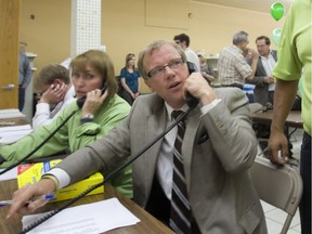 Premier Brad Wall on the phone.
