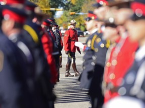 Weyburn Traffic Services corporal Sean Chiddenton inspects the parade formation during the Saskatchewan Police and Peace Officers Memorial held at the Legislative Building in Regina, Sask. on Sunday Sept. 25, 2016.