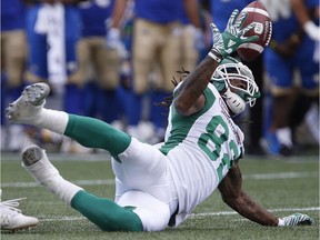 Naaman Roosevelt, shown making a spectacular catch Saturday against the host Winnipeg Blue Bombers, may not play Sunday against the visiting Edmonton Eskimos due to injury.