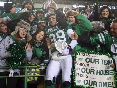 Wide receiver Chris Getzlaf #89 of the Saskatchewan Roughriders celebrates with fans following his teams 45-23 victory over the Hamilton Tiger-Cats during the 101st Grey Cup Championship Game at Mosaic Stadium on November 24, 2013 in Regina, Canada.