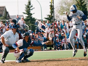 A member of the Toronto Blue Jays jumps to avoid a pitch during a May 11, 1989 exhibition game against the National Baseball Institute Blues at Taylor Field.
