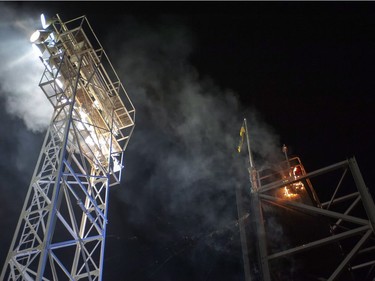 A small fire burns on top of the scoreboard prior to the Saskatchewan Roughriders and Calgary Stampeders facing off in CFL football action in Regina, Sask., Friday, October 3, 2014.