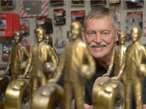Regina's Abe Loewen poses with some of the trophies he has won during a successful drag racing career.