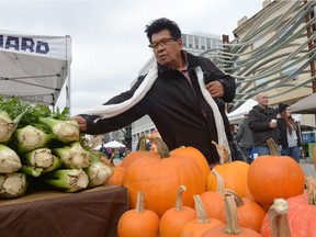 Alex Pelletier checks out the celery on display at the Regina Farmers' Market last outdoor market of the year at City Square Plaza in Regina, Sask. on Saturday Oct. 8, 2016.