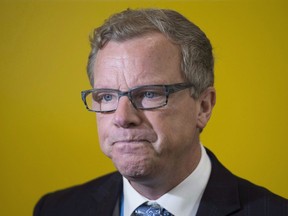 Premier Brad Wall speaks to the media at the United Nations climate change summit in Le Bourget, France, on Nov. 30, 2015, where he said a carbon tax would "kneecap" an already struggling economy.