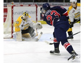 Brandon Wheat Kings goalie Jordan Papirny stops a shot from Regina Pats centre Sam Steel during a WHL game at the Brandt Centre on Saturday. Steel eventually had the last laugh, recording one goal and two assists in a 5-2 win over the defending WHL champions.