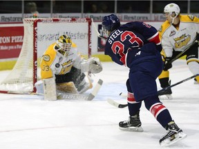 Brandon Wheat Kings goalie Jordan Papirny stops a shot by Regina Pats forward Sam Steel during a game held at the Brandt Centre in Regina, Sask. on Saturday Oct. 8, 2016. MICHAEL BELL