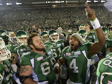 Saskatchewan Roughriders quarterback Darian Durant (4) leads his team on the field as they face the Hamilton Tiger-Cats in the Grey Cup Sunday November 24, 2013 in Regina.