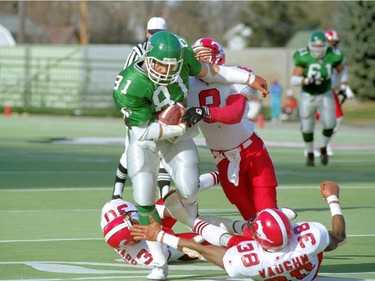 Saskatchewan Roughriders slotback Ray Elgaard tramples Calgary Stampeders defenders on Oct. 23, 1993.