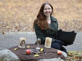 Erin Wood, a member of the Congregationalist Wiccan Association of Saskatchewan, poses near a makeshift altar in Victoria Park.