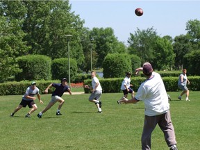 An age-old Wascana Centre summer tradition of Saturday afternoon touch football featuring a group of workmates and friends.