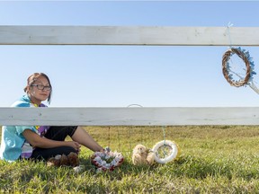 Janine Windolph, president of the Regina Indian Industrial School commemorative association, at a fence that marks the RIIS cemetary in Regina, Saskatchewan on Tuesday September 27, 2016. The RIIS cemetery was granted heritage status by Regina city council on Monday.