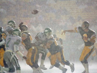 Mike Kerrigan of the Hamilton Tiger-Cats throws a pass against the Saskatchewan Roughriders on July 28, 1989 at Taylor Field.