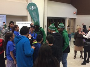 Saskatchewan Roughriders talking to some Scott Collegiate after the announcement of an education program to be launched at the North Central Shared Facility, Mamaweyanatitan .
(KERRY BENJOE/Regina Leader-Post