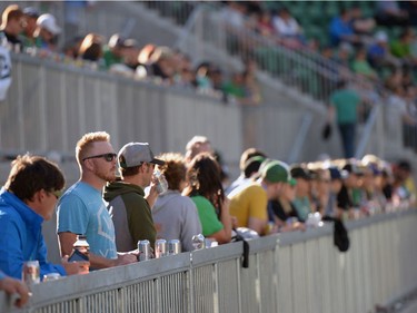 People stand in the Terrace section of the new Mosaic Stadium test event featuring the University of Regina Rams vs. the University of Saskatchewan Huskies in Regina, Sask. on Saturday Oct. 1, 2016.