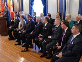 Saskatchewan Premier Brad Wall, left, introduced his new cabinet in Regina in August.