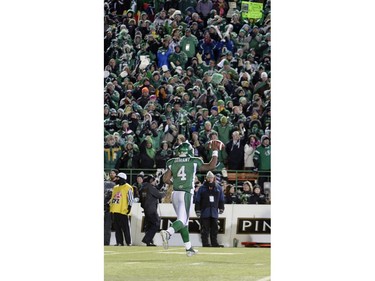 Saskatchewan Roughriders quarterback Darian Durant (#4) runs back to the bench holding the ball above his head in the fourth quarter of the 101st Grey Cup game held at Mosaic Stadium in Regina, Sask. on Sunday Nov. 24, 2013