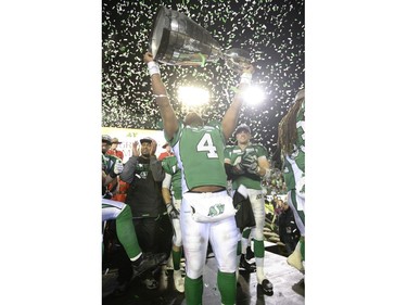 Saskatchewan Roughriders quarterback Darian Durant (#4) hoists the Grey Cup in victory at the end of the 101st Grey Cup game held at Mosaic Stadium in Regina, Sask. on Sunday Nov. 24, 2013.