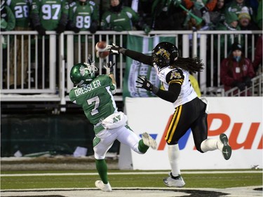 Saskatchewan Roughriders slotback Weston Dressler (#7) makes a touchdown reception despite Hamilton Tiger-Cats defensive back Rico Murray's (#0) block attempt in the fourth quarter of the 101st Grey Cup game held at Mosaic Stadium in Regina, Sask. on Sunday Nov. 24, 2013