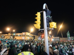 Photos of fans that poured onto the Green Mile on Albert St. to celebrate the Riders victory in Grey Cup 101 in Regina Monday November 25 2013.