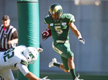 University of Regina Rams' Kahlen Branning jumps the tackle of a University of Saskatchewan Huskies defender at the new Mosaic Stadium in Regina.  This is the first event ever held at the new stadium.
