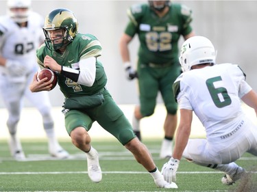 University of Regina Rams' QB Noah Picton runs the ball against the University of Saskatchewan Huskies at the new Mosaic Stadium in Regina.  This is the first event ever held at the new stadium.