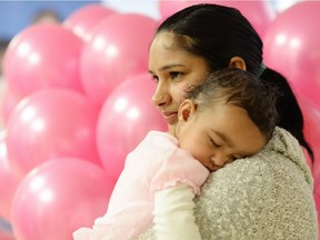 Aman Dhaliwal holds her 11-month-old daughter Sahej at the Regina General Hospital during an event to celebrate the Pink Ladoo Project in Regina.  The Pink Ladoo Project was created to raise awareness of gender-bias practices in South Asian cultures and to equally celebrate the birth of all babies, regardless of gender.