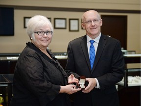 Trina Hodel, left,  of the Alzheimer Society of Saskatchewan, and Mike Abrahamowicz, owner of Victoria Jewellers, hold a $12,650 ladies' diamond ring, the grand prize at the Night to Remember Fall Gala, which will be held Oct. 27 at the Casino Regina Show Lounge.