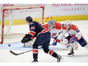 Regina Pats forward Luc Smith puts the puck past Spokane Chiefs goalie Jayden Sittler during the first period of WHL action at the Brandt Centre on Friday.