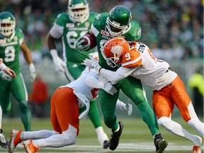 Riders receiver Phil Bates took on two Lions tacklers in last Saturday's game at Mosaic Stadium.