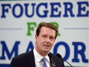 Mayor Michael Fougere lays out his election platform at his campaign headquarters in Regina.