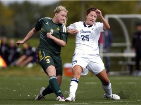 University of Regina Cougars midfielder Kayla McDonald (left), shown here in a file photo, hopes her team can clinch a playoff spot this weekend.