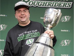 Brendan Taman with the Grey Cup one day after the Saskatchewan Roughriders defeated the Hamilton Tiger-Cats 45-23 at Mosaic Stadium.