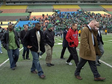 Coach Paul Lapolice wipes his face as the Saskatchewan Roughriders returned to Mosaic Stadium for the last time this year to over 1000 cheering fans in Regina November 20, 2009. The Riders lost in the Grey Cup 28-27 to the Montreal Allouettes.