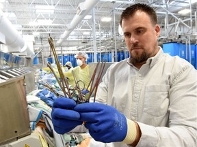 K-Bro general manager Sean Jackson with surgical tools found on the sort line by employees where linen from health-care facilities is sorted.  K-Bro staff work on the assumption that soiled laundry is free of debris, such as needles, but that is not always the case.