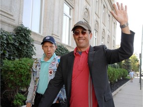 Comedian Jerry Seinfeld waves to fans outside the Hotel Saskatchewan prior to his Sept. 9, 2011 performance at the Brandt Centre.