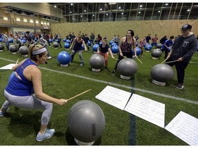 Students take part in a DrumFit class during Positive Lifestyles, a conference for 800 Grade 8 students from Regina Catholic schools.
