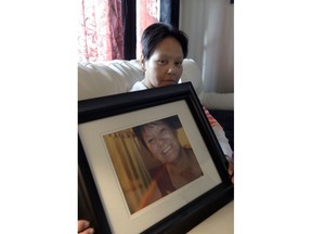 Lisa Tapaquon holds a picture of her late sister, Juliette Tapaquon. 
The Tapaquon family says there is no doub that Juliette was the victim of stereotyping and racism when she was a palliative care patient at the Pasqua Hospital.