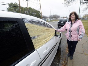 Shelley Johnson stands next to her vehicle that  had a window broken out of it as a rash of vandalism hit her neighbourhood.