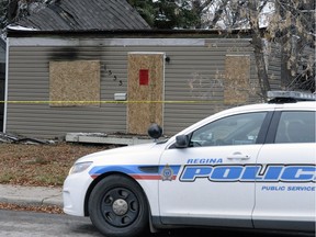 REGINA,Sk: OCTOBER 6, 2016 -- Police are posted in front of a house on McTavish Street in Regina that was the scene of a fire. A body was discovered in the house.   BRYAN  SCHLOSSER/Regina Leader Post