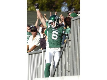 Roughriders wide receiver Rob Bagg hauls in a touchdown pass and then celebrates with the fans.