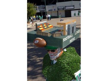 Fans of both teams showed their spirit at the Labour Day Classic on Sunday, including Winnipeg-based Rider fan Barry Smith (top left), who proudly wore his custom-made hat, a scale model of Mosaic Stadium complete with LED lights and colour-coded seating to match the stands.