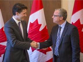 Prime Minister Justin Trudeau and Premier Brad Wall, shown here meeting in April, are at odds over the federal carbon tax plan, which Wall opposes.