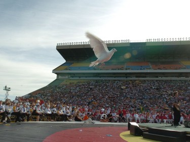 A lone dove makes its way to the skies during the release of 100 white doves for the 2005 Canada Summer Games closing ceremonies at Taylor Field in Regina on Saturday.